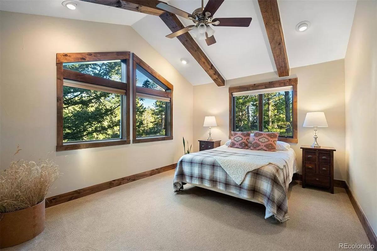 Bedroom with Vaulted Ceilings and Tree-Lined Views