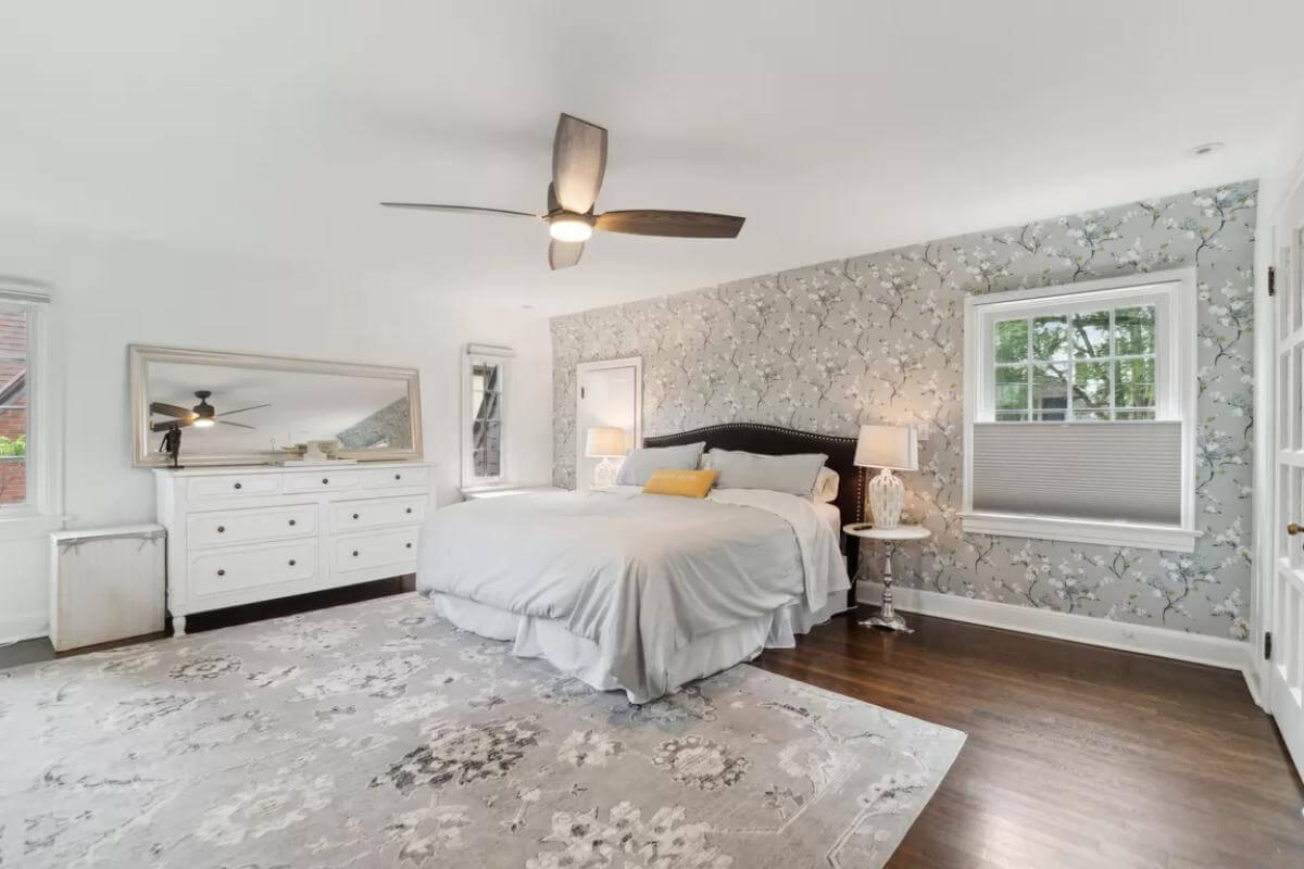 Relax in This Bedroom with Floral Wallpaper and Elegant Accents
