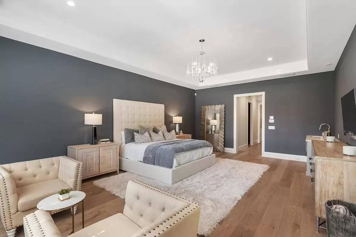 Admire the Luxurious Chandelier in This Refined Bedroom