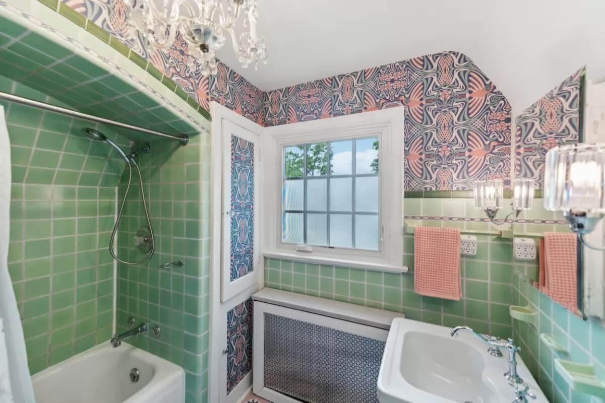 Charming Bathroom with Retro Green Tiles and Bold Wallpaper