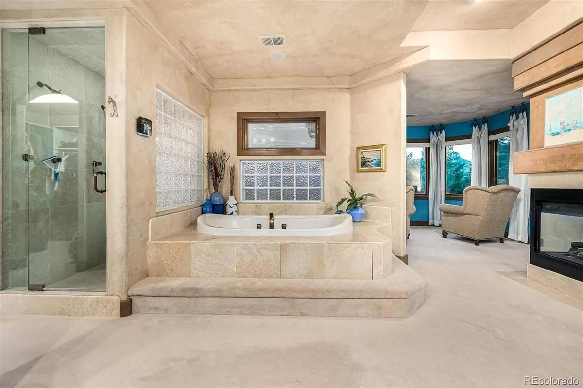 Check Out the Elevated Tub and Glass Block Detail in This Luxurious Bath