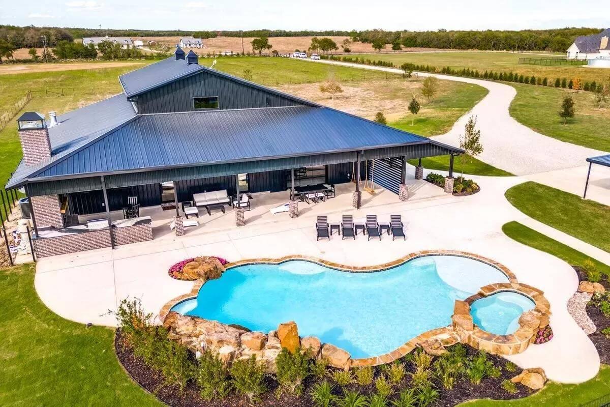 Discover This Expansive Patio with a Poolside Retreat