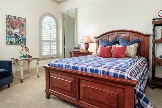Cozy Bedroom with Classic Wooden Furniture and Sports Accents