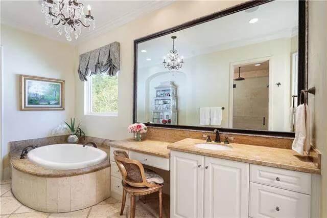 Elegant Bathroom Oasis with a Corner Tub and Vanity