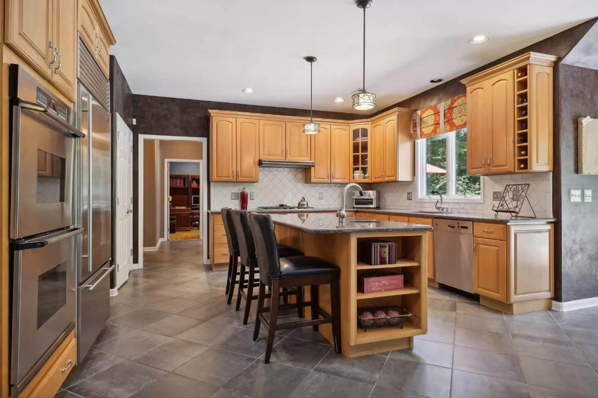 Spacious Kitchen with Granite Island and Abundant Cabinetry