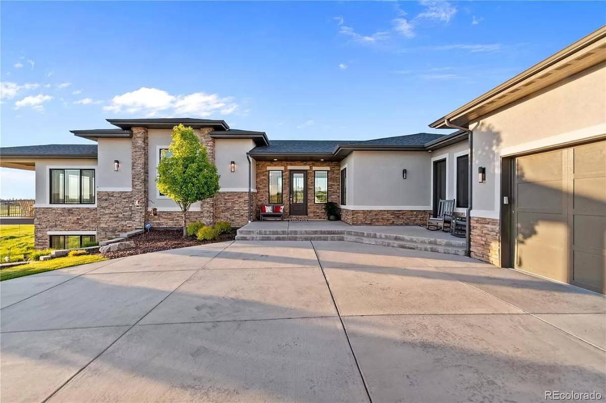 Check Out the Striking Stone Facade and Welcoming Front Porch