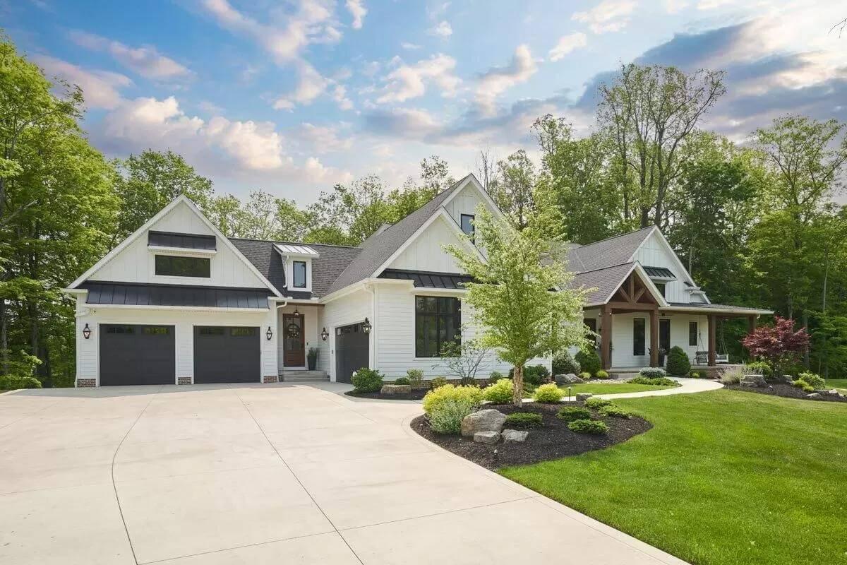 Elegant Craftsman Home with Inviting Double Garage and Lush Landscaping