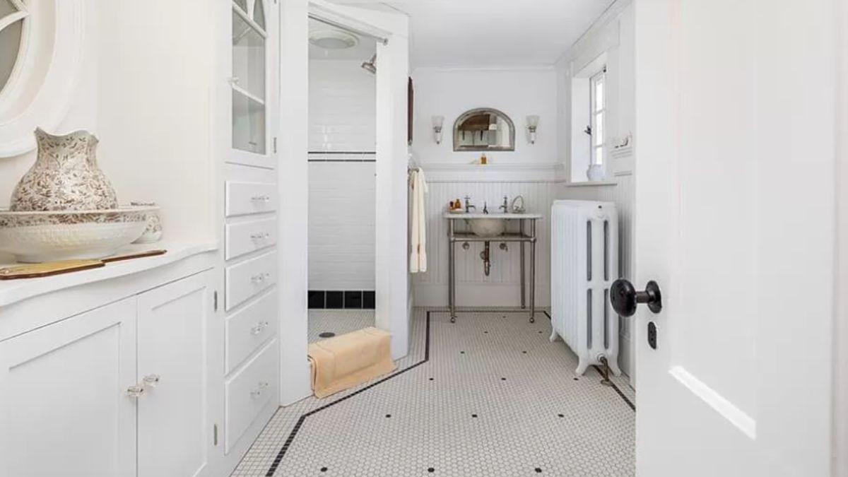 Quaint Bathroom with Vintage Details and Built-In Storage