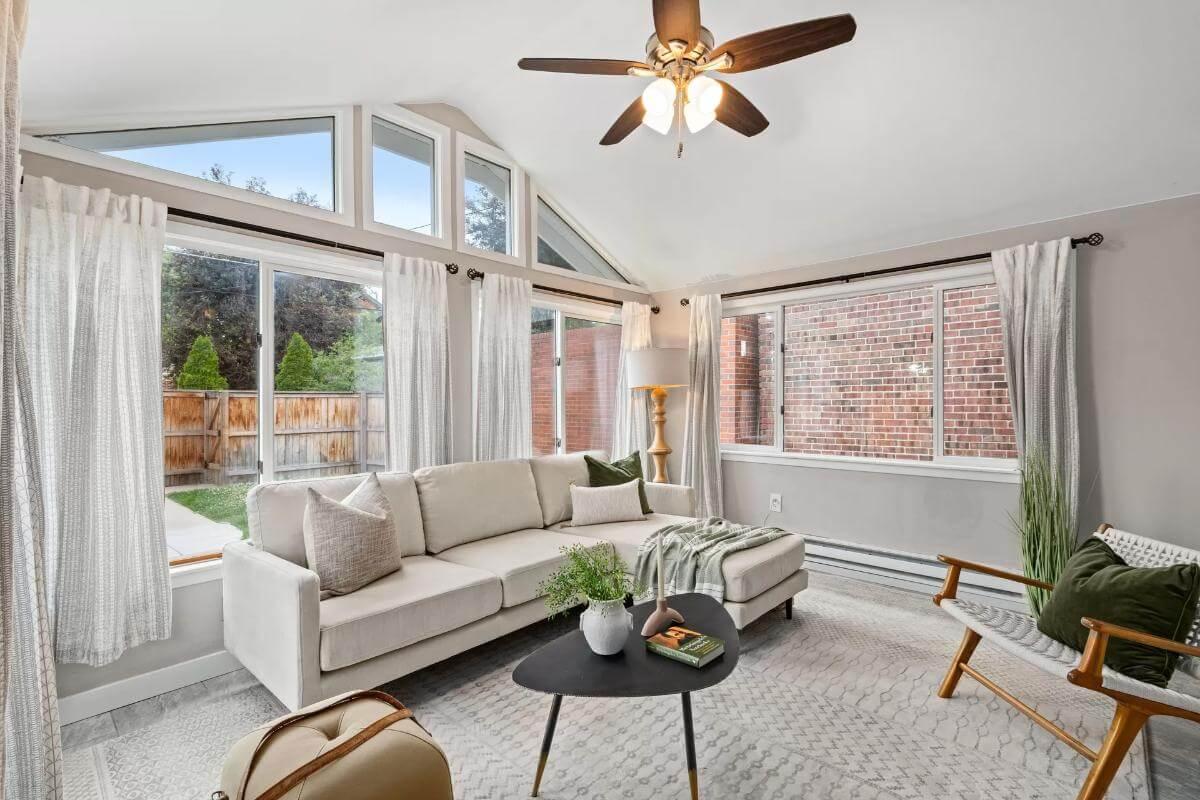 Airy Sunroom with Vaulted Ceilings and Serene Garden Views