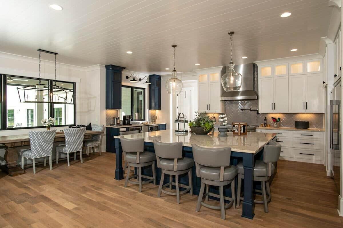 Explore This Expansive Island and Sleek Pendant Lighting in the Kitchen