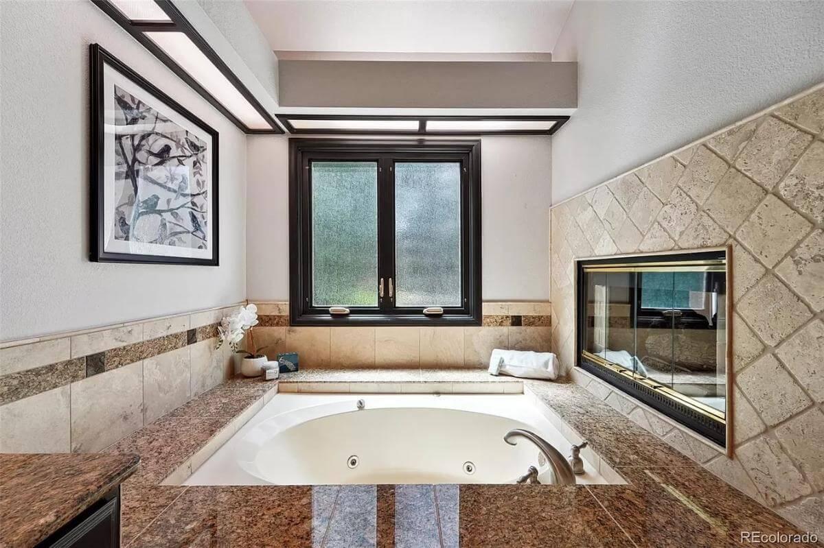 Luxurious Bathroom Retreat with a Built-In Fireplace
