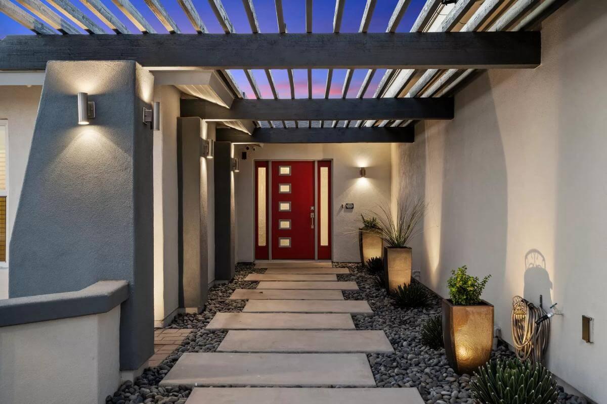 Discover the Striking Red Front Door Framed by Modern Design