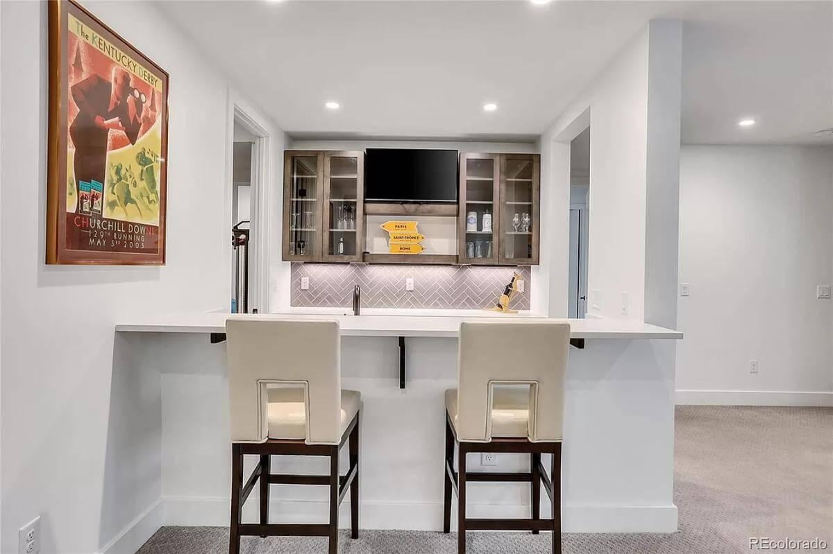 Explore the Stylish Home Bar with a Herringbone Backsplash