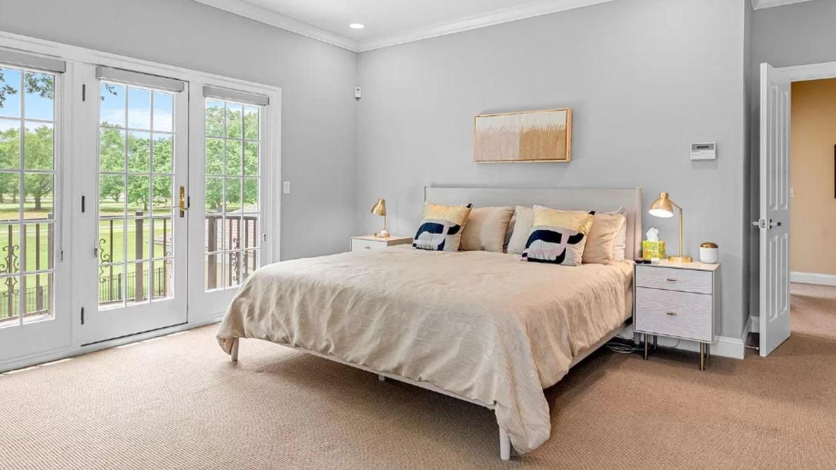 Serene Bedroom with French Doors and Subtle Art