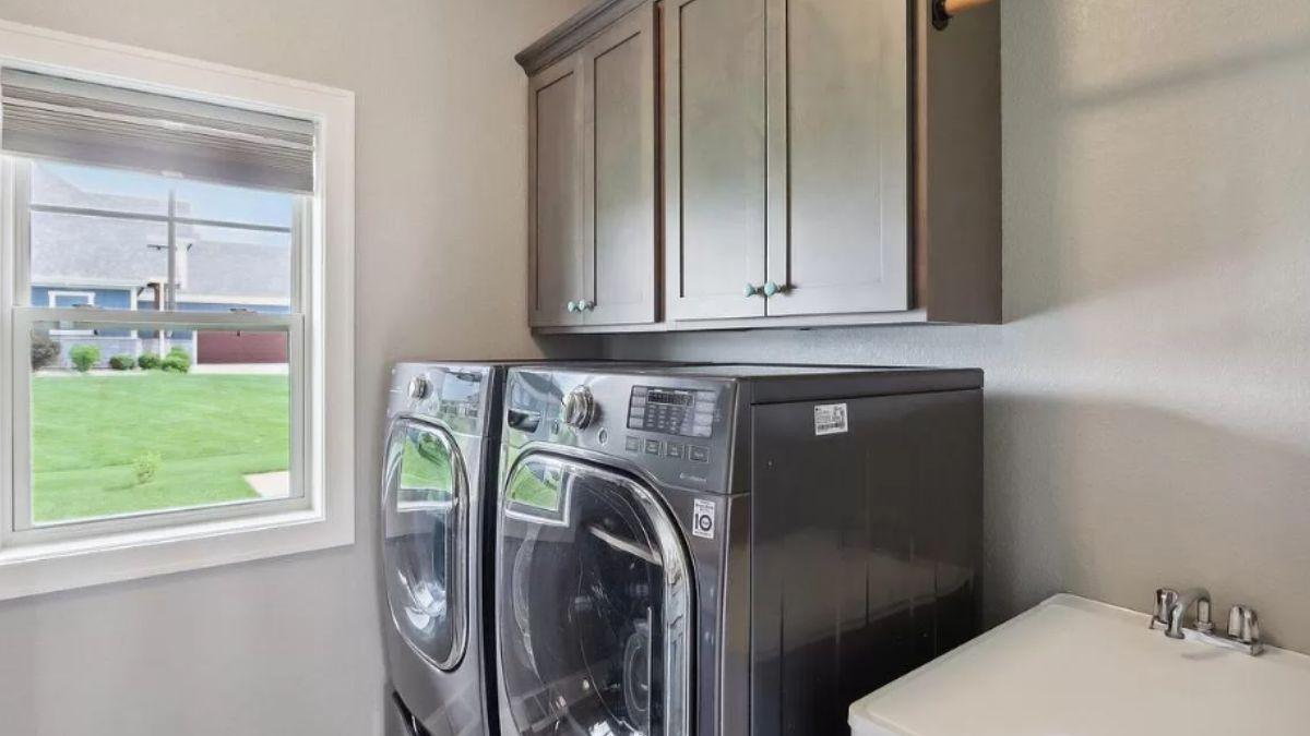 Peek Into This Practical Laundry Room with a Handy Wall Rack