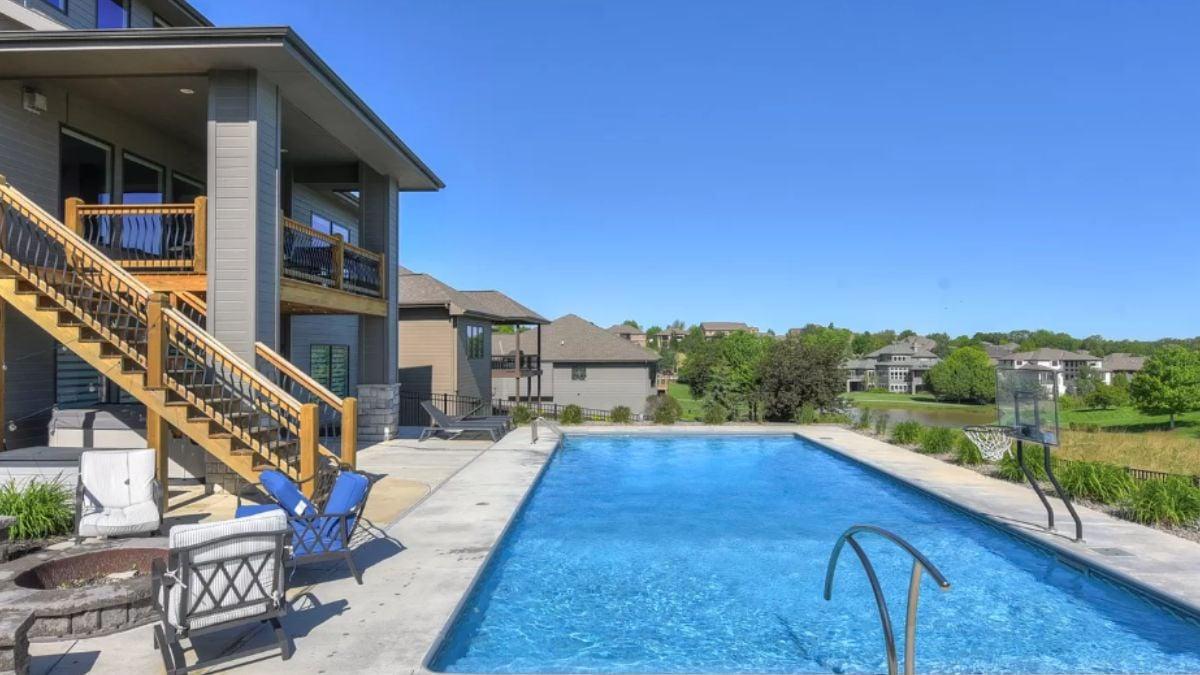 Enjoy the Outdoor Living Area Next to This Inviting Pool