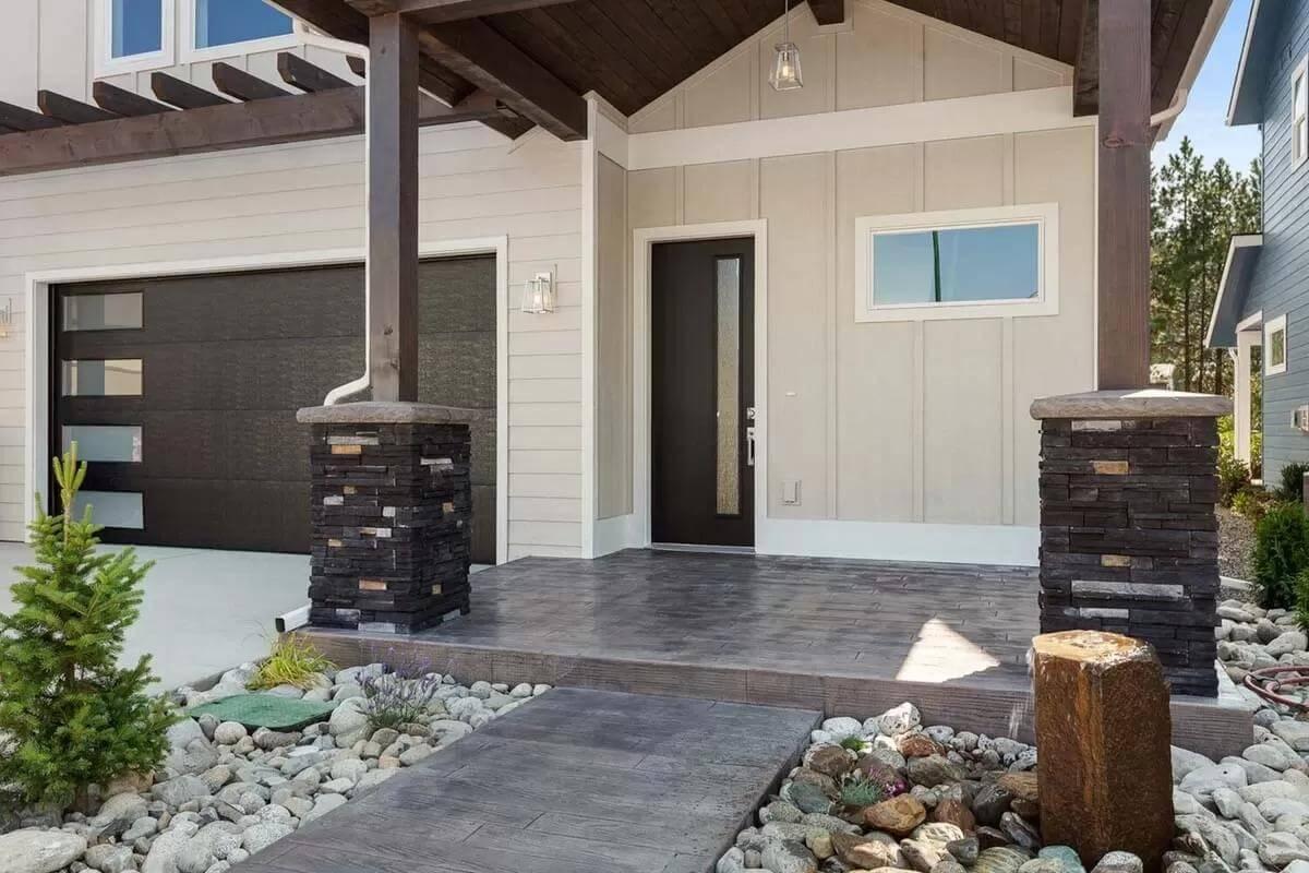 Stone Columns and Sleek Lines Define This Inviting Entryway