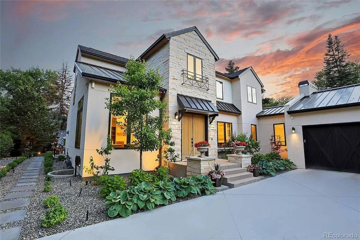 Admire the Stone Facade and Metal Roof of This Charming Craftsman Home