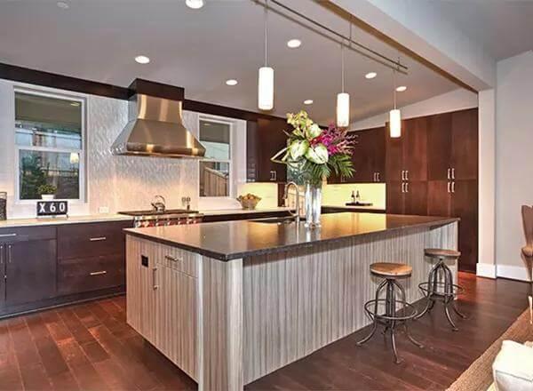 Sleek Kitchen with a Striking Island and Industrial Accents
