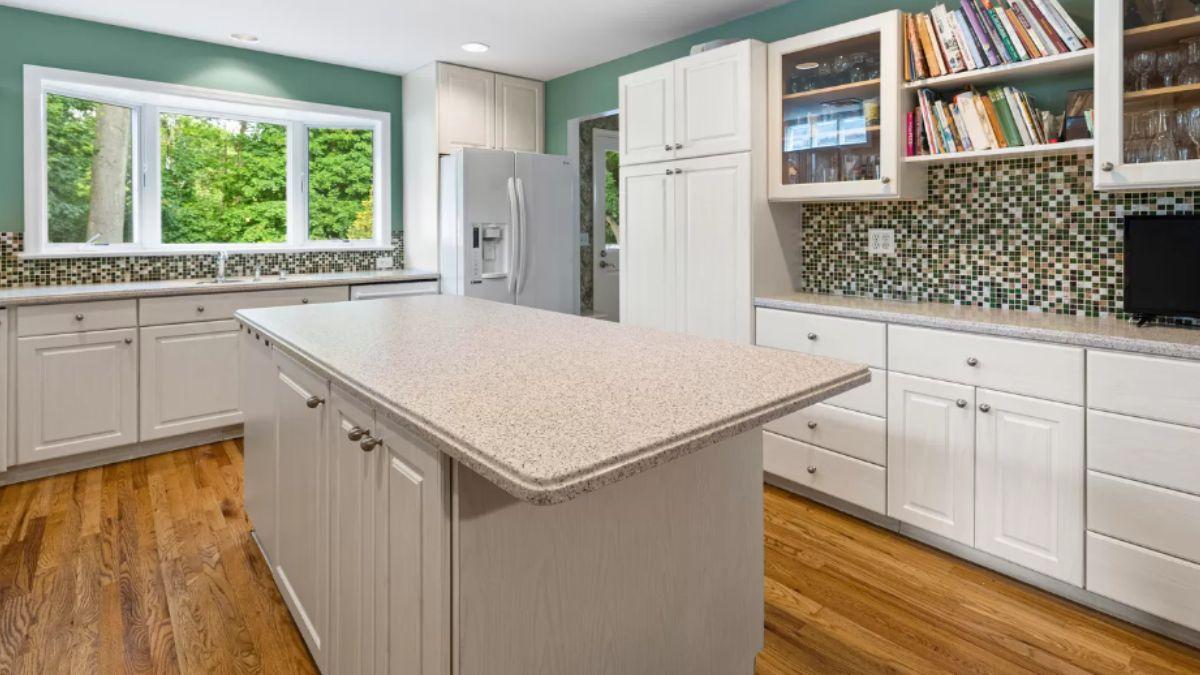 Appreciate the Expansive Island in This Bright Kitchen