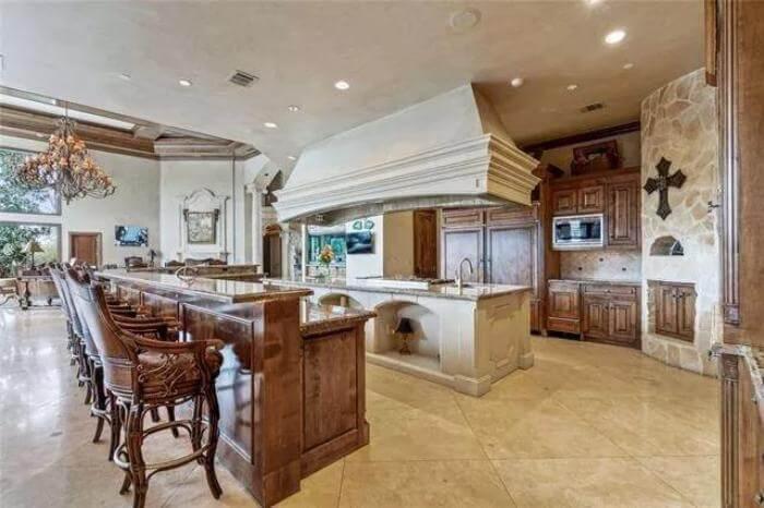 Expansive Kitchen with a Massive Range Hood as the Centerpiece