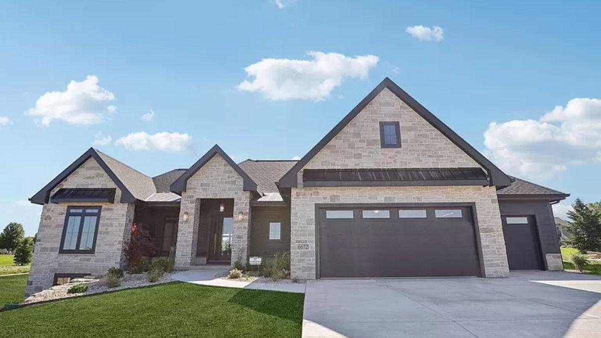 Check Out the Bold Contrast of Stone and Dark Rooflines in This Craftsman Home