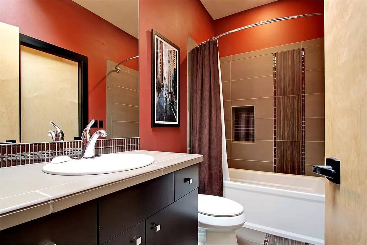 Check Out the Bold Red Walls and Subway Tile Accents in This Bathroom