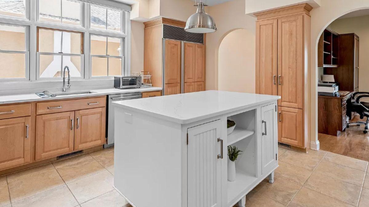 Kitchen with a Bright Island and Arched Doorway