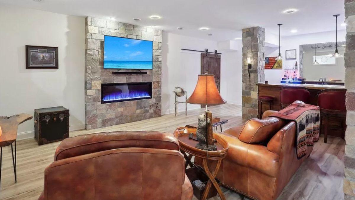 Cozy Basement Retreat with Stone Fireplace and Wet Bar