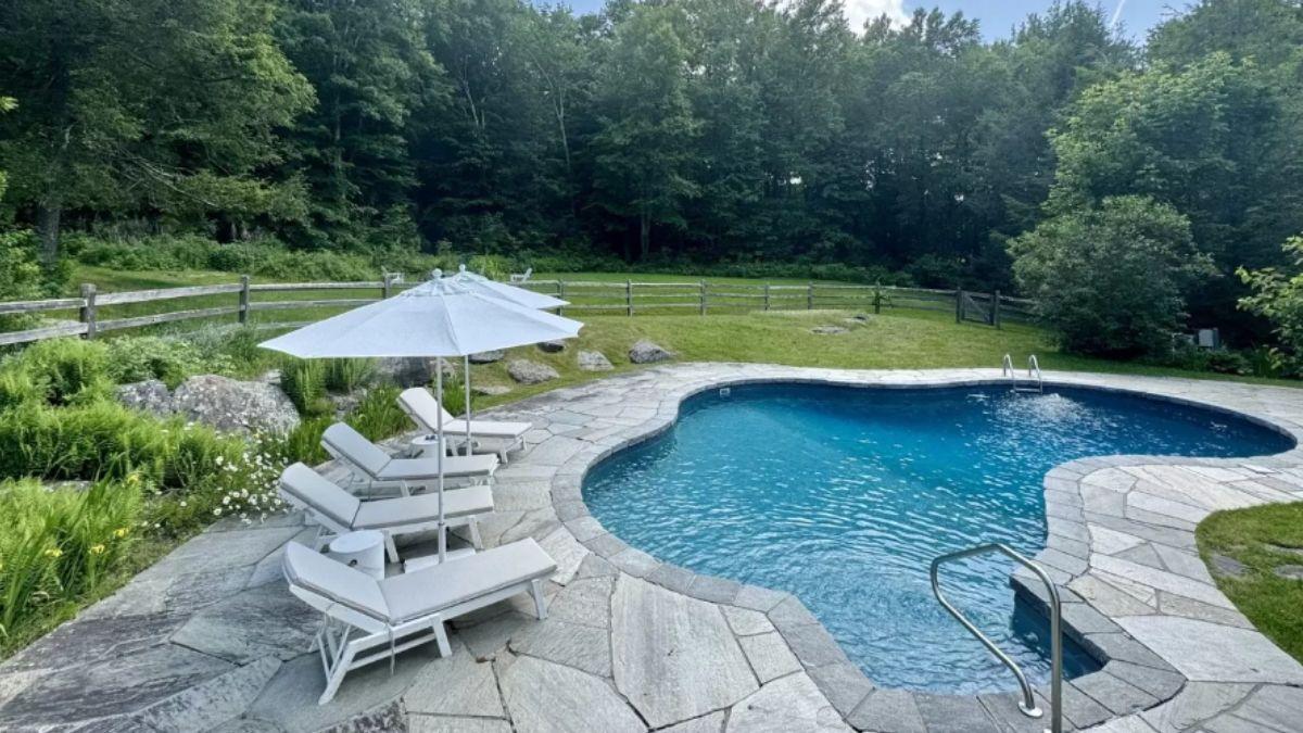 Relax by the Stone-Edged Pool: A Perfect Outdoor Retreat