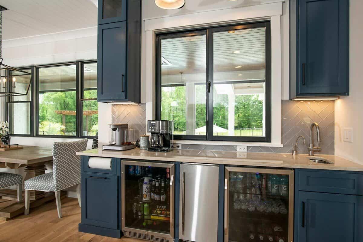 Check Out the Chic Navy Cabinets in This Functional Beverage Station