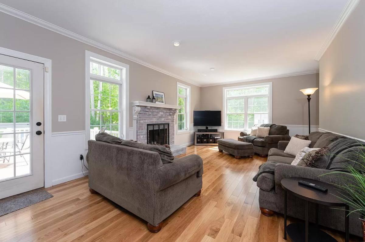 Check Out the Cozy Fireplace in This Bright Living Room