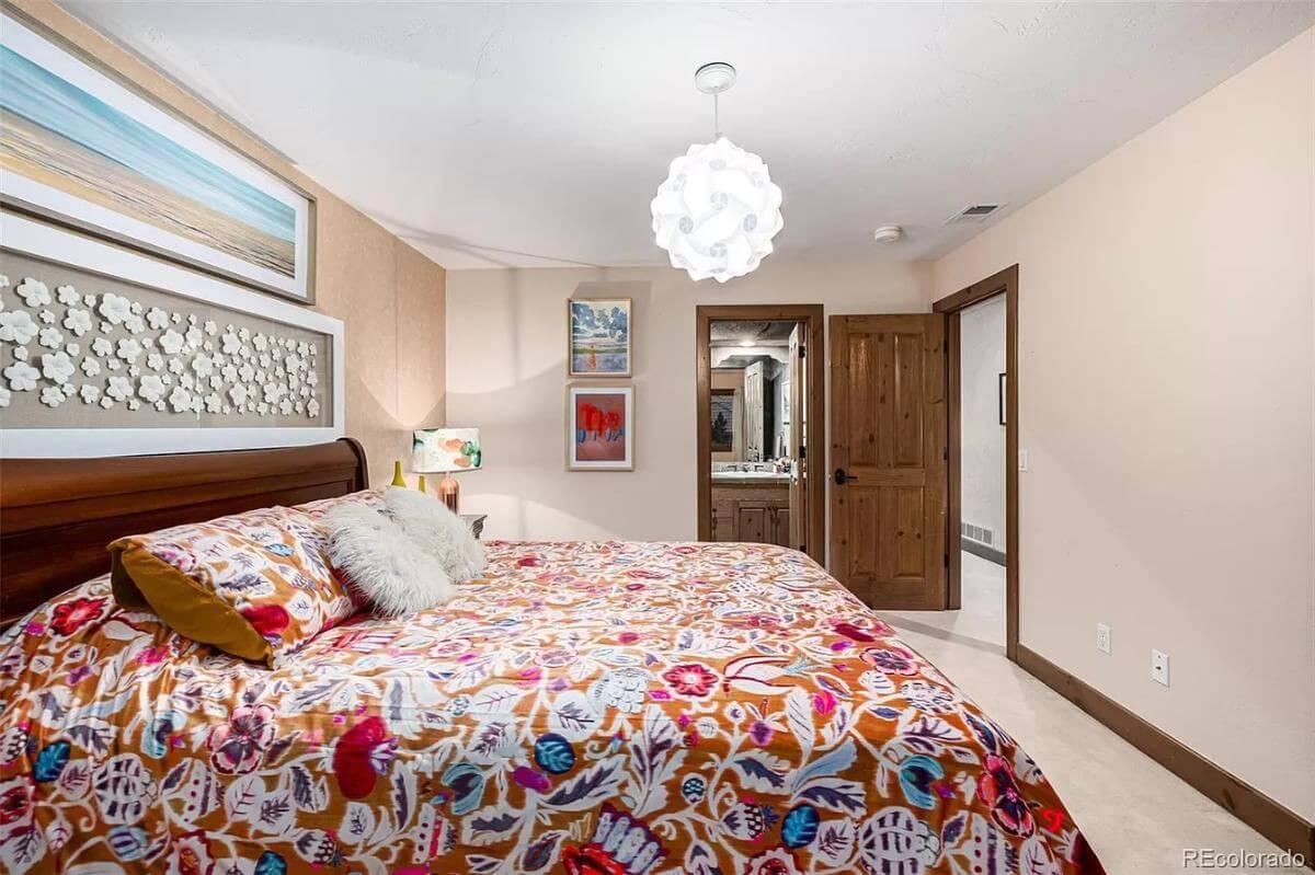 Notice the Vibrant Bedding in This Warm and Inviting Bedroom