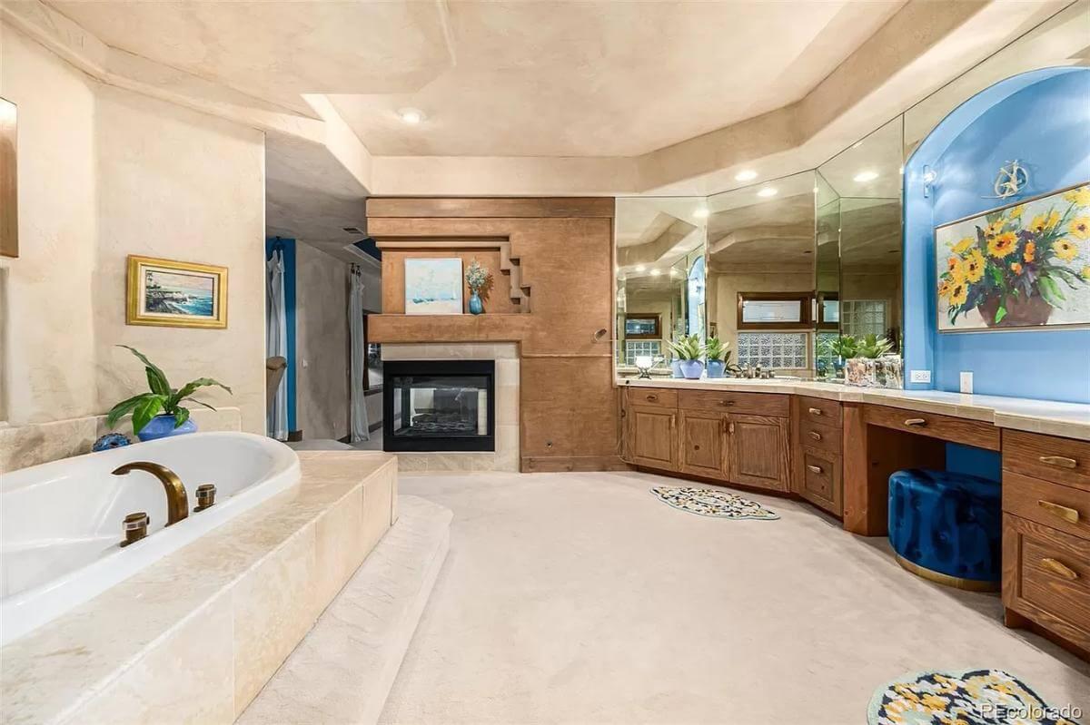 Relax in a Luxurious Master Bath with a Double-Sided Fireplace