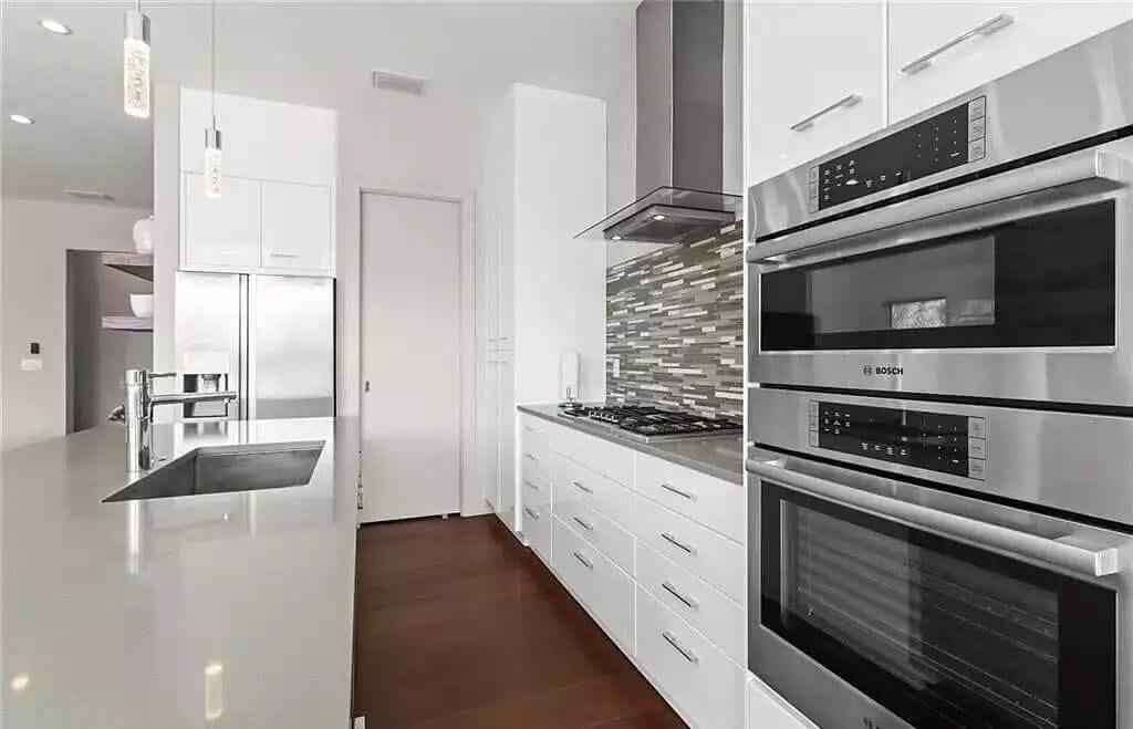 Sleek Kitchen with Eye-Catching Vertical Tile Backsplash
