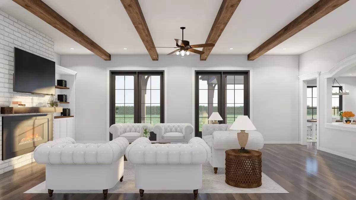 Modern Living Room with White Tufted Sofas and Rustic Beams