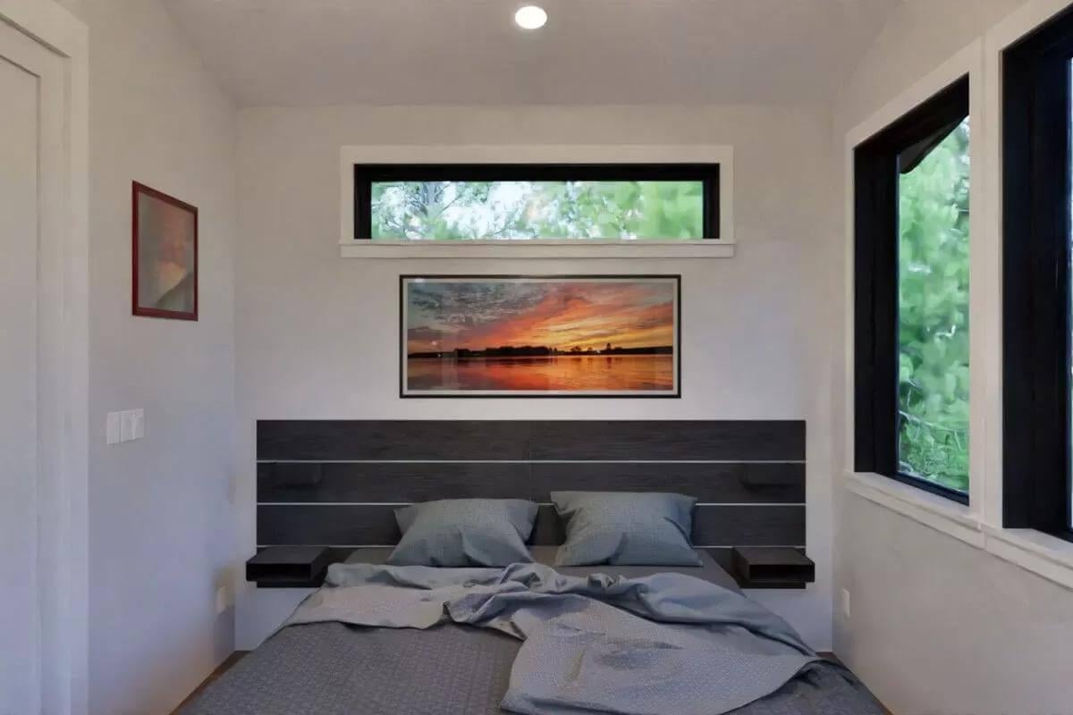 Compact Bedroom with Bold Windows and Striking Wall Art