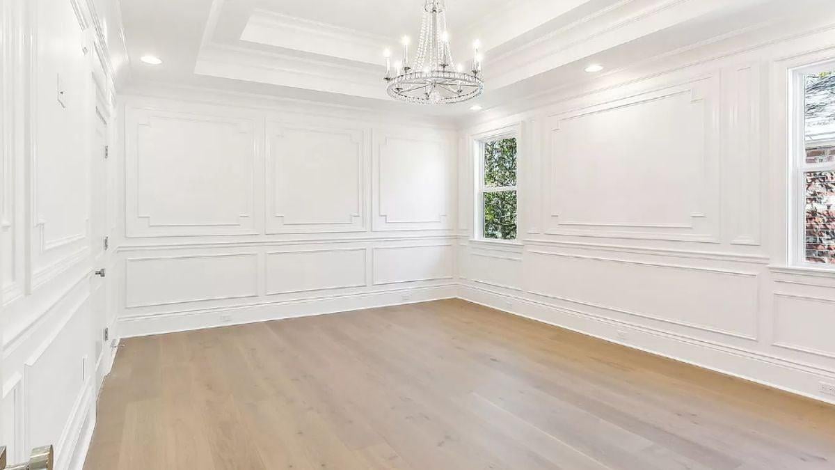 Elegant Molding and a Crystal Chandelier in This Refined Space