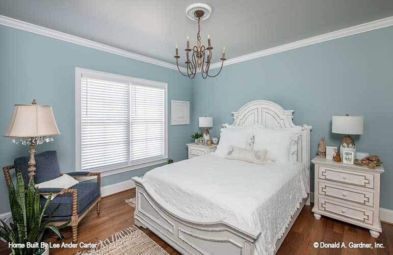 Tranquil Bedroom with Vintage-Inspired Chandelier and Sky Blue Walls