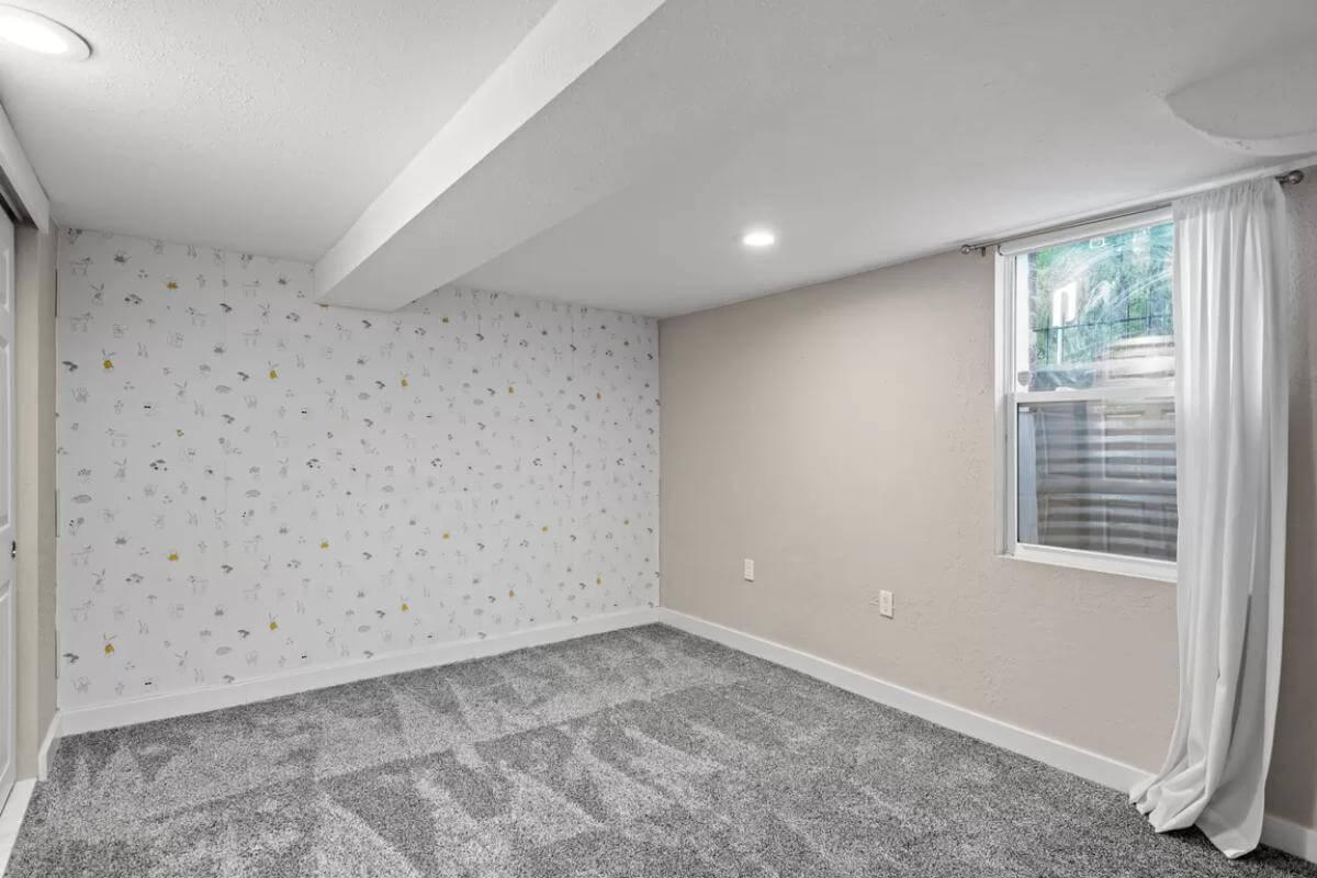 Wallpaper Accent Adds Character to Versatile Basement Space