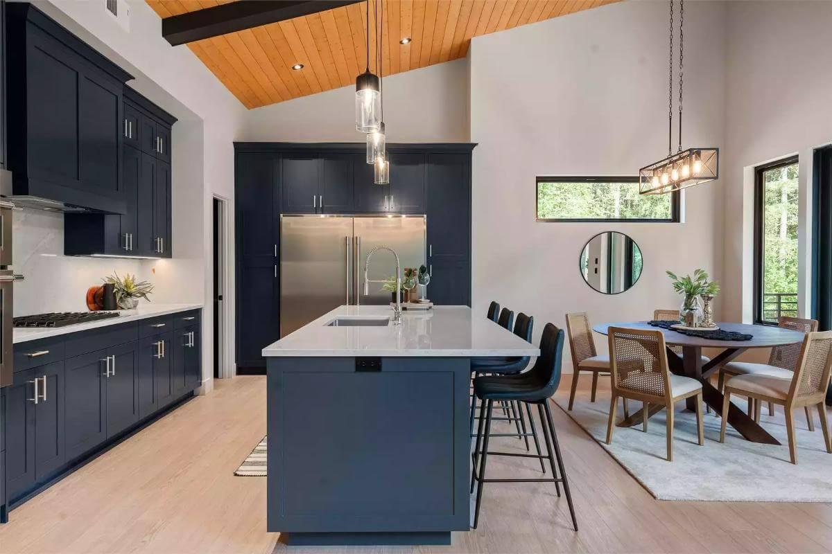 Explore a Kitchen with Navy Cabinets and Light Wood Ceiling