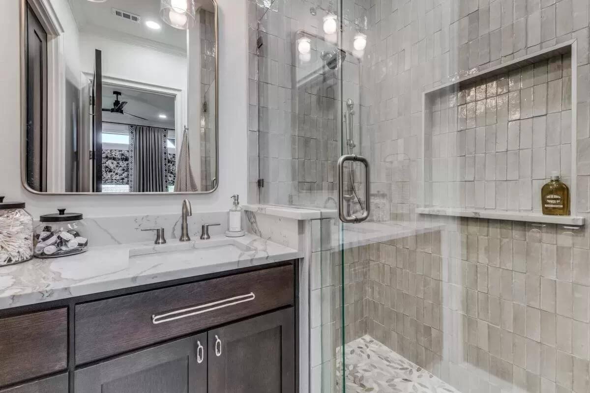 Sleek Bathroom with Marbled Vanity and Subway Tile Shower
