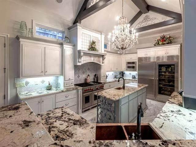 Notice the Vaulted Ceilings and Striking Chandelier in This Elegant Kitchen