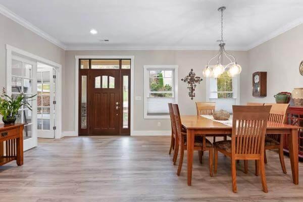 Notice the Elegant Wooden Dining Table and Pendant Lighting