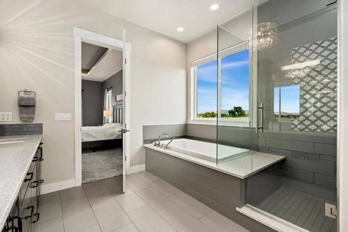 Gorgeous Bathroom with a Glass-Encased Shower and Inviting Tub for Relaxation