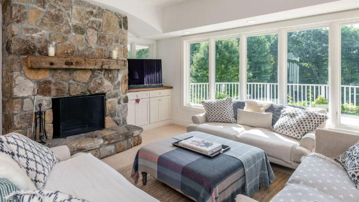 Cozy Living Room with a Stunning Stone Fireplace