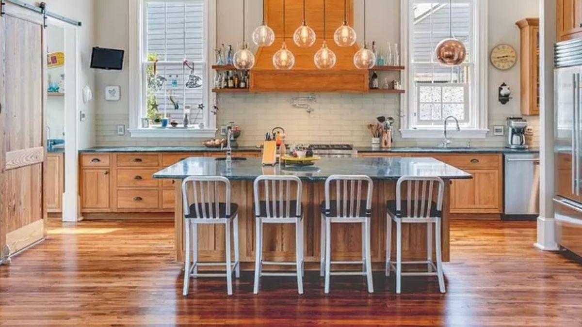 Check Out the Striking Pendant Lights and Timeless Oak Cabinets in This Kitchen
