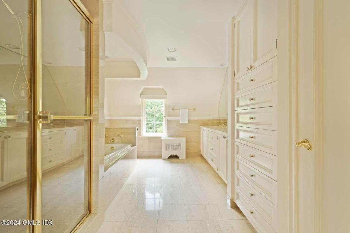 Check Out the Dual Vanities and Skylight in This Elegant Bathroom