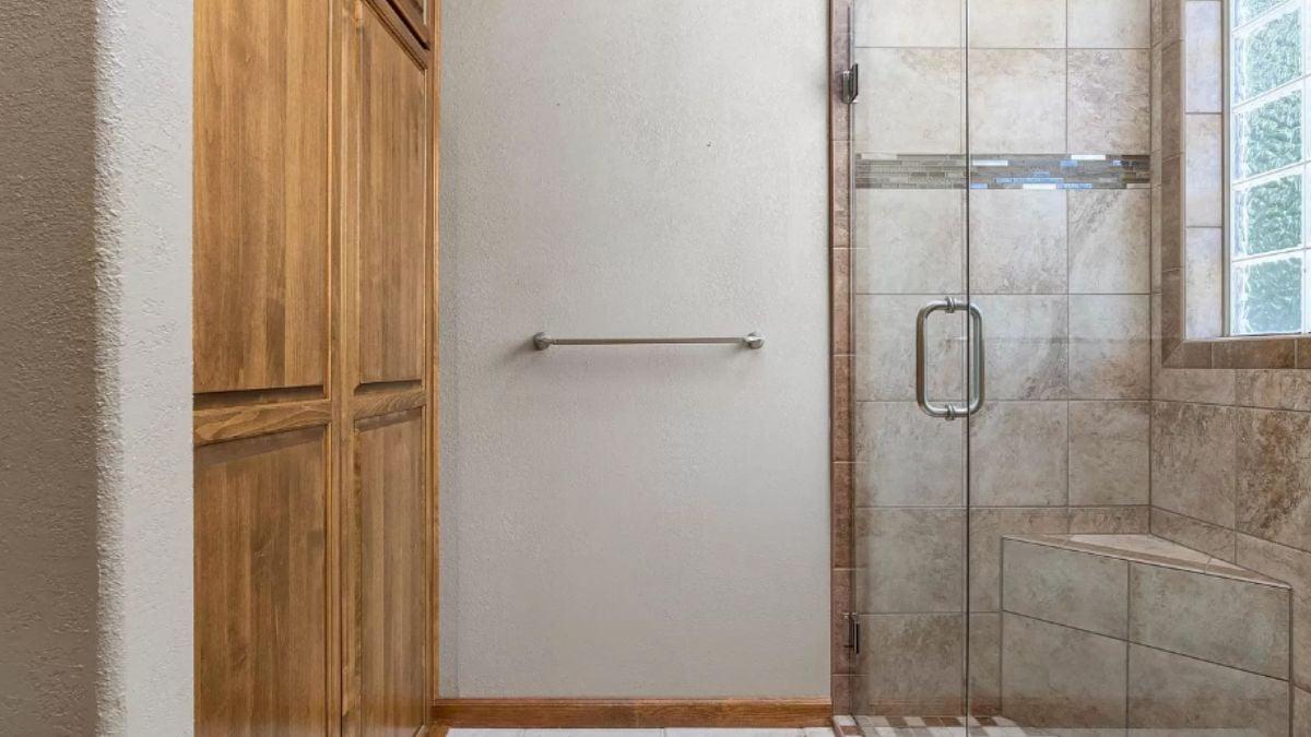 Elegant Bathroom with Built-In Bench and Natural Wood Cabinetry