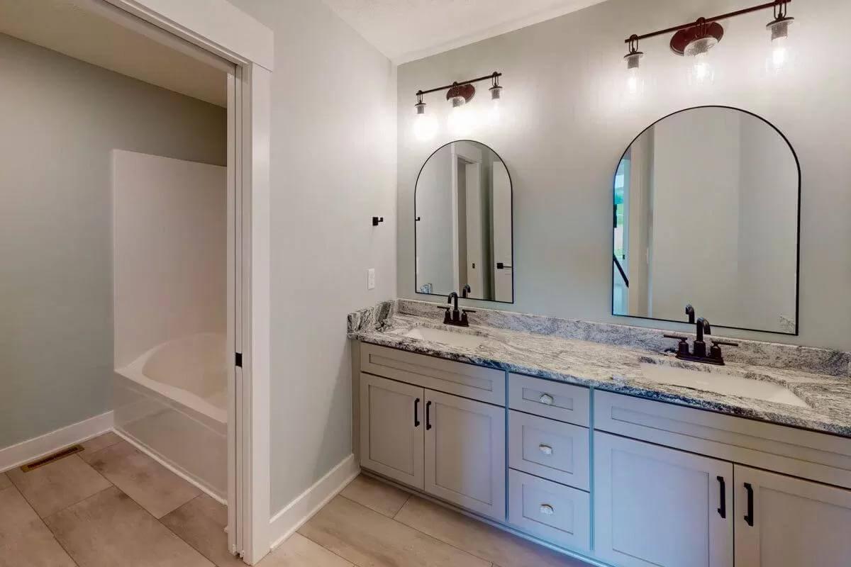 Spot the Arched Mirrors in This Bright Bathroom